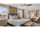 Cozy bedroom with neutral tones, large windows, and stylish furniture at 350 Friendship Oak Way, Hampton, GA 30228