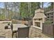 Backyard dining and fireplace at 202 Firefly Ct, Peachtree City, GA 30269