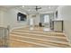 Finished basement with entertainment area, desk, and work area with a window for natural light at 202 Firefly Ct, Peachtree City, GA 30269