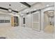 Expansive basement area featuring an infrared sauna, barn door, and recessed lighting at 202 Firefly Ct, Peachtree City, GA 30269