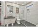 Modern bathroom with glass shower, decorative tiles, a unique sink, and natural light at 202 Firefly Ct, Peachtree City, GA 30269