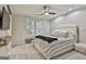 Cozy bedroom featuring a ceiling fan, neutral decor and a comfortable bed with plush bedding at 202 Firefly Ct, Peachtree City, GA 30269
