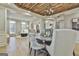 Dining room with wood plank ceiling open to the living spaces, perfect for entertaining at 202 Firefly Ct, Peachtree City, GA 30269