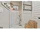 Dog wash station with white subway tile and shower head. Wicker storage baskets provide ample storage at 202 Firefly Ct, Peachtree City, GA 30269