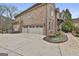 Attractive brick home showcasing a three-car garage and meticulously kept grounds at 202 Firefly Ct, Peachtree City, GA 30269