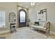 Bright foyer featuring a brick floor, stylish bench, and elegant decor at 202 Firefly Ct, Peachtree City, GA 30269