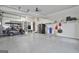 Spacious garage with epoxy floors, storage shelves, and plenty of room for parking at 202 Firefly Ct, Peachtree City, GA 30269