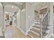 Hallway with hardwood floors, stairs, and a view into other rooms at 202 Firefly Ct, Peachtree City, GA 30269