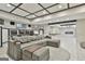 Inviting open living area featuring a large sofa, media chairs, and kitchenette at 202 Firefly Ct, Peachtree City, GA 30269