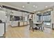 Spacious living room with hardwood floors, large windows, built-in shelving, and a fireplace at 202 Firefly Ct, Peachtree City, GA 30269
