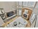 Bright living room with hardwood floors, a fireplace, large windows, and stylish chandelier providing luxury at 202 Firefly Ct, Peachtree City, GA 30269
