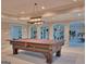 Basement with billiard table and gym equipment provides ample space for recreation and fitness at 101 Glen Eagle Way, Mcdonough, GA 30253