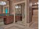 Bathroom featuring double sinks, large mirrors, and walk-in closet at 101 Glen Eagle Way, Mcdonough, GA 30253