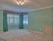 Bedroom with shuttered windows and a closet at 101 Glen Eagle Way, Mcdonough, GA 30253