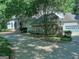 A long driveway to the house leading to a three car garage and is surrounded by mature trees at 101 Glen Eagle Way, Mcdonough, GA 30253