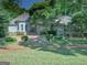 Elegant exterior featuring a lush lawn and mature trees, creating a private and inviting atmosphere at 101 Glen Eagle Way, Mcdonough, GA 30253