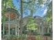 Beautiful two-story home featuring a two-story gazebo, stairs to the entrance, and balconies at 101 Glen Eagle Way, Mcdonough, GA 30253