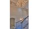 Elegant staircase with a view of a chandelier and an archway on the second floor at 101 Glen Eagle Way, Mcdonough, GA 30253