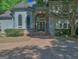 Inviting front entrance with brick archway and steps leading to a large double door entry at 101 Glen Eagle Way, Mcdonough, GA 30253