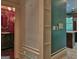 Hallway to bathroom, with view into the kitchen with the window and island at 101 Glen Eagle Way, Mcdonough, GA 30253
