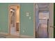 Hallway showcasing the home's interior with a bathroom and staircase at 101 Glen Eagle Way, Mcdonough, GA 30253