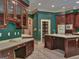 Well-equipped kitchen featuring an island with cooktop, cabinetry, and tile flooring at 101 Glen Eagle Way, Mcdonough, GA 30253