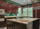 Spacious kitchen with a large island, stainless appliances, wood cabinets and exterior views at 101 Glen Eagle Way, Mcdonough, GA 30253