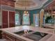 Gourmet kitchen with large island cooktop and view to breakfast nook with lush, green views at 101 Glen Eagle Way, Mcdonough, GA 30253