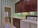 Laundry room with upper and lower cabinets, folding counter, washer, and dryer at 101 Glen Eagle Way, Mcdonough, GA 30253