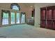 Open living room featuring french doors, built in cabinets, and carpet at 101 Glen Eagle Way, Mcdonough, GA 30253