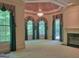 Spacious living room featuring a fireplace, large windows, and elegant chandelier at 101 Glen Eagle Way, Mcdonough, GA 30253