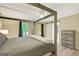 Bedroom with a four-poster bed, ceiling fan, and convenient access to bathroom via sliding barn door at 180 Bentley Way, Fayetteville, GA 30214