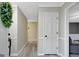 Inviting foyer featuring neutral paint, stylish flooring, and a glimpse into adjacent living spaces at 180 Bentley Way, Fayetteville, GA 30214