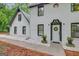 Close up view of the entrance, showing the beautiful door and flower box accents at 180 Bentley Way, Fayetteville, GA 30214
