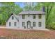 Charming two-story home with a well-maintained lawn and welcoming entrance with a decorative wreath at 180 Bentley Way, Fayetteville, GA 30214