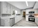 Bright kitchen featuring white cabinets, stainless steel appliances and breakfast nook, perfect for casual dining at 180 Bentley Way, Fayetteville, GA 30214