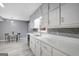 Bright kitchen featuring ample white cabinetry, stainless steel appliances, and a view to the breakfast nook at 180 Bentley Way, Fayetteville, GA 30214