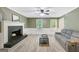 Spacious living room with a cozy fireplace, modern flooring, and a soothing color palette at 180 Bentley Way, Fayetteville, GA 30214