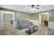 Open-concept living room with ample seating, stylish decor, and easy access to multiple areas at 180 Bentley Way, Fayetteville, GA 30214