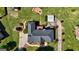 Expansive aerial view of home with landscaped yard, circular driveway, and fire pit at 220 Edna Ruth Ln, Mcdonough, GA 30253