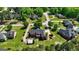 Expansive aerial view of home featuring manicured lawn, mature trees, and circular driveway at 220 Edna Ruth Ln, Mcdonough, GA 30253