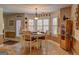 Sunlit breakfast nook with charming table, chairs, neutral decor and beautiful ceramic tiled floors at 220 Edna Ruth Ln, Mcdonough, GA 30253