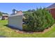Carport featuring trailer storage, complemented by lush greenery and a well-manicured lawn at 220 Edna Ruth Ln, Mcdonough, GA 30253