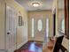 Inviting home foyer with hardwood floors, a decorative front door, and neutral paint at 220 Edna Ruth Ln, Mcdonough, GA 30253