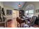 Well-lit home office featuring hardwood floors, custom built desk, and large window with shutter at 220 Edna Ruth Ln, Mcdonough, GA 30253