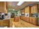Bright kitchen with wood cabinets, an island, and appliances at 220 Edna Ruth Ln, Mcdonough, GA 30253