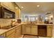 Stylish kitchen featuring granite countertops, updated appliances, and light cabinets at 220 Edna Ruth Ln, Mcdonough, GA 30253