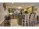Charming kitchen featuring an island with seating, stainless steel appliances, and lots of cabinets at 220 Edna Ruth Ln, Mcdonough, GA 30253