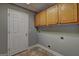 Functional laundry room with cabinets and washer/dryer hookups at 220 Edna Ruth Ln, Mcdonough, GA 30253