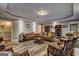 Spacious living room with wood floors, tray ceilings, recessed lighting, and comfortable seating at 220 Edna Ruth Ln, Mcdonough, GA 30253